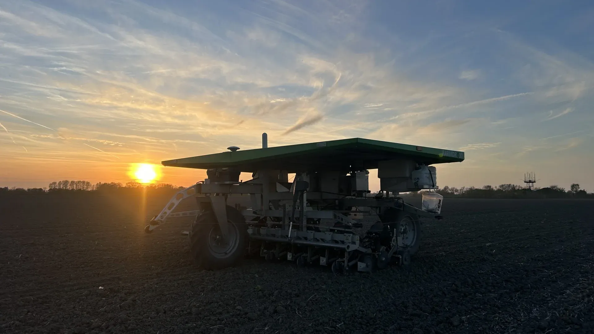 FarmDroid FD20 at sunset in freshly tilled soil