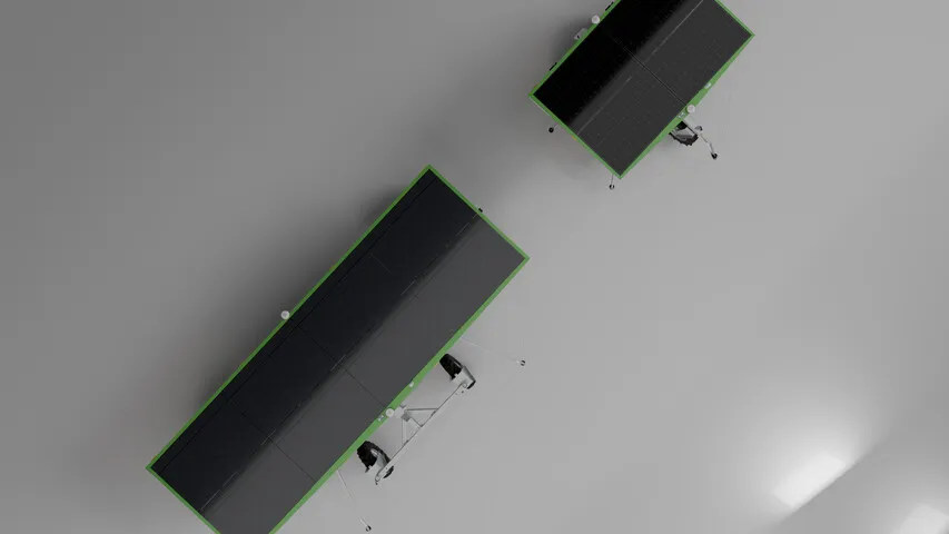 Two FarmDroid robots viewed from above, with their solar panels visible
